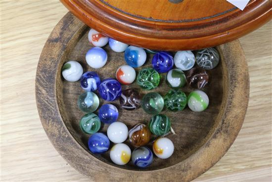 A treen solitaire board and marbles, a parquetry box and treen leaf tray